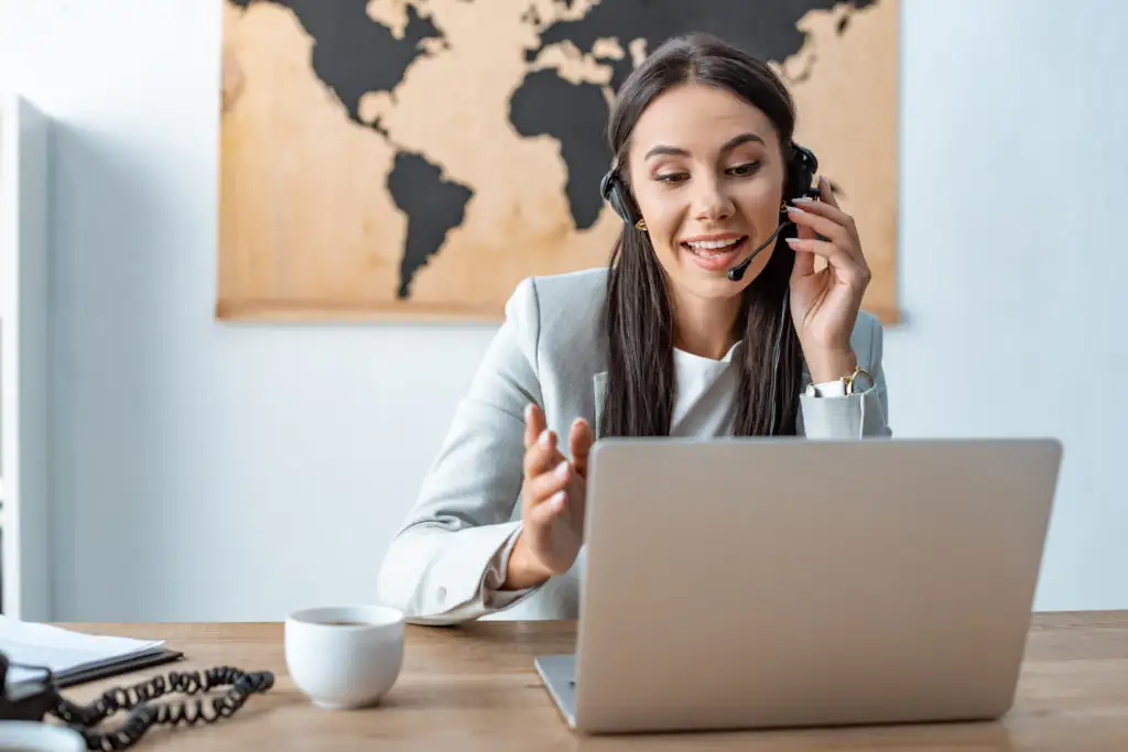Travel agent working from laptop