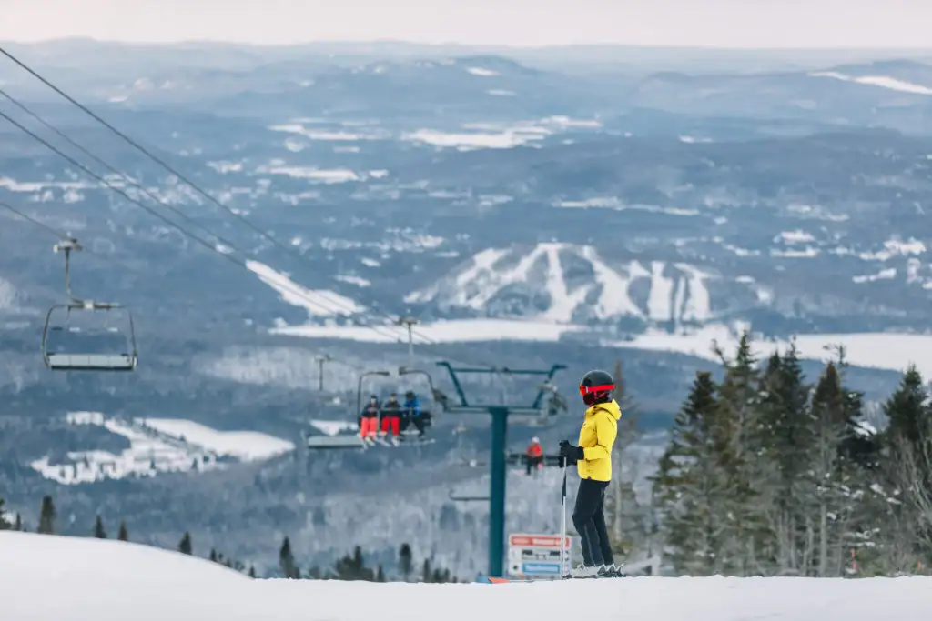 Person skiing down snowy slope in Mont-Tremblant, Canada