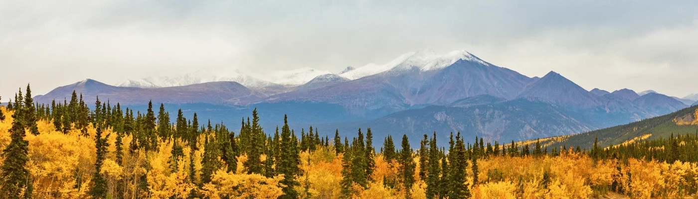 Alaska mountains landscape nature background in autumn fall season. Snow peaks banner panorama