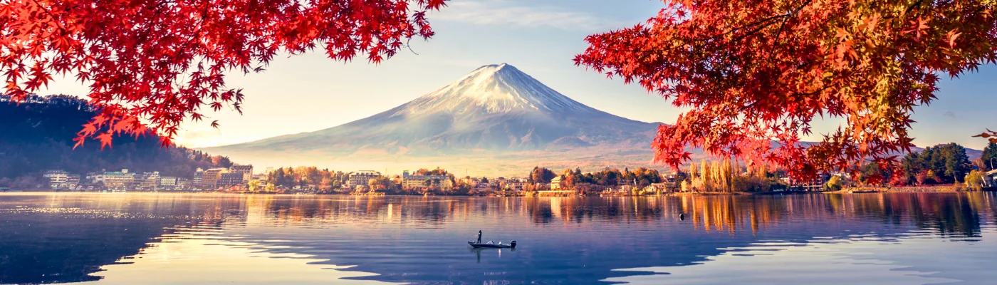 Colorful Autumn Season and Mountain Fuji with morning fog and red leaves at lake Kawaguchiko