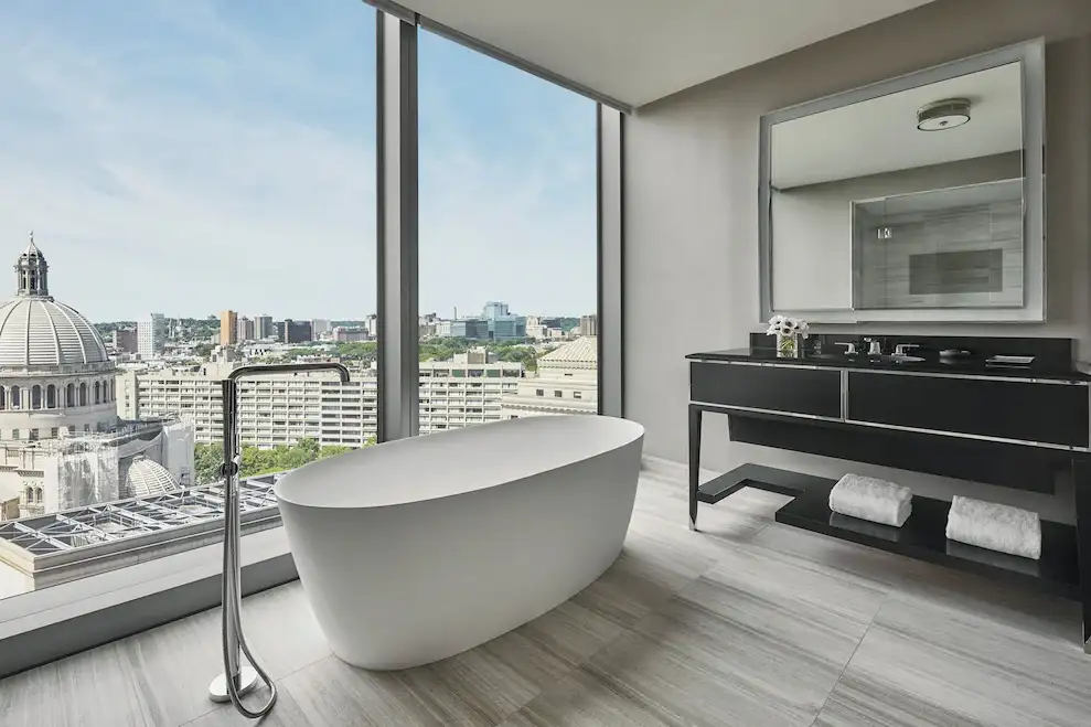 Luxurious soaking tub in bathroom at Four Seasons Hotel One Dalton Street in Boston, Massachusetts, United States