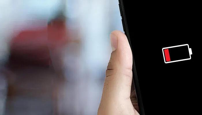 Close up of smartphone with low battery warning