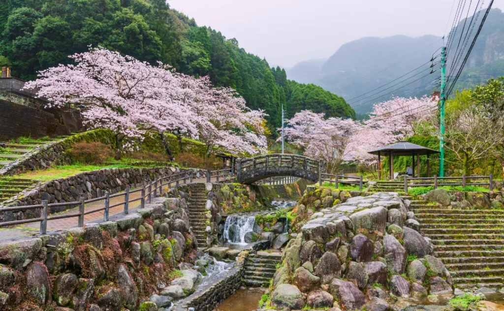 Park with cascading water and skura tunnel at Okawachiyama, Imari