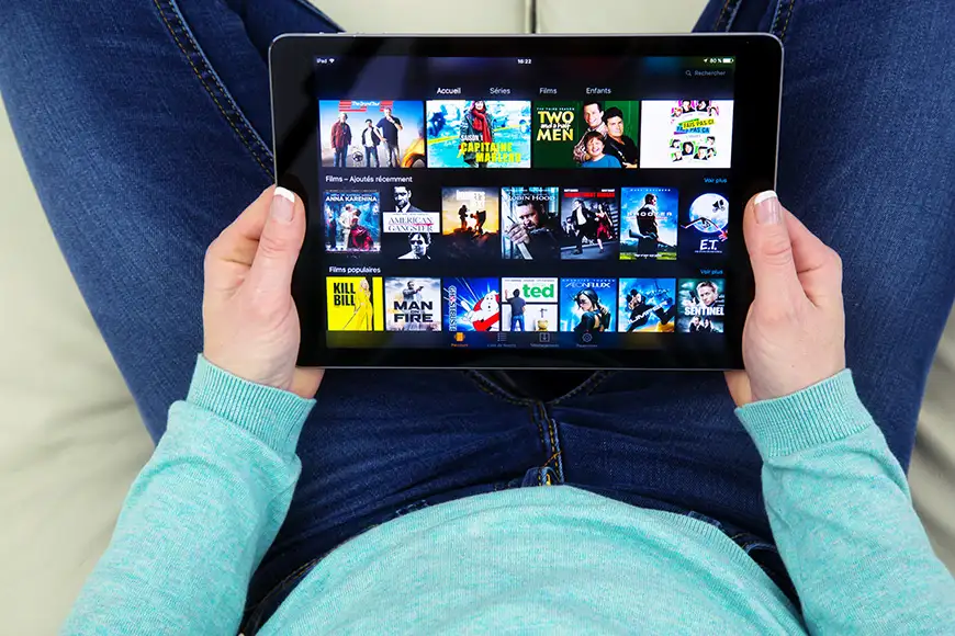 man watching prime video on ipad