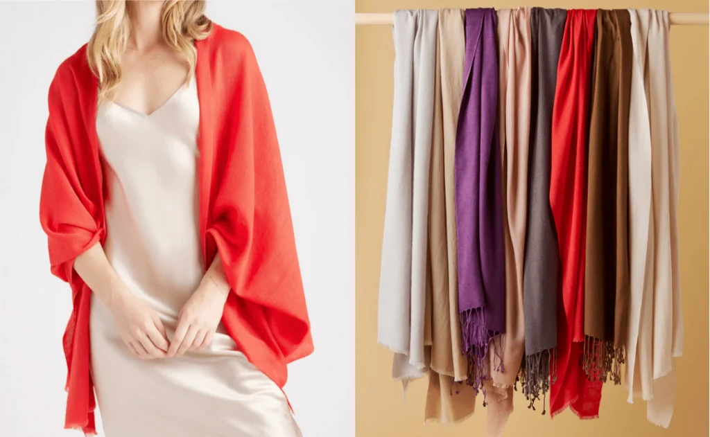 Quince Scarf worn on model in red next to hanging scarfs in assorted colors