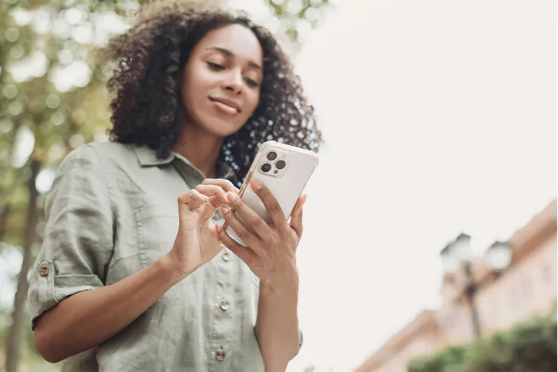 Woman using smartphone outside